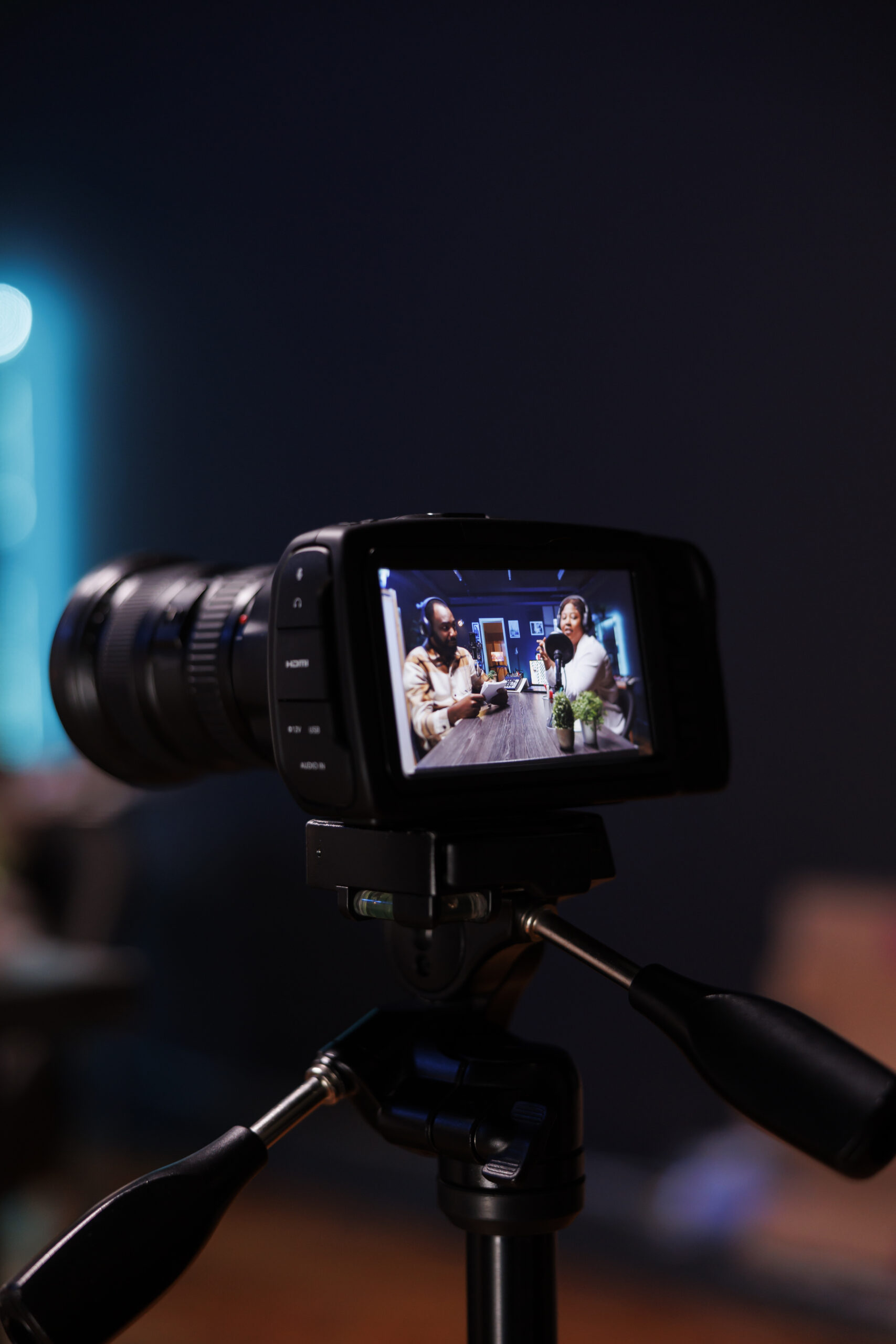 Camera on tripod filming live talk show